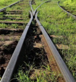 stock-photo-steel-railway-tracks-at-the-main-station-anchored-to-a-combination-of-concrete-and-wood-sleepers-2462873611(1)